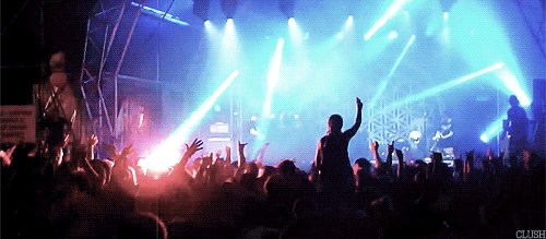 Decorative: a scene of a conception of fun – people cheering at a concert.